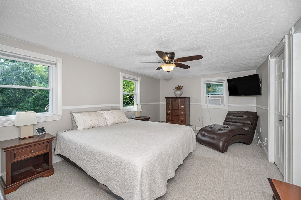 21 Sherwood Road Wilmington, MA 01887 - Photo 17 of 42 a bedroom with a bed and furniture