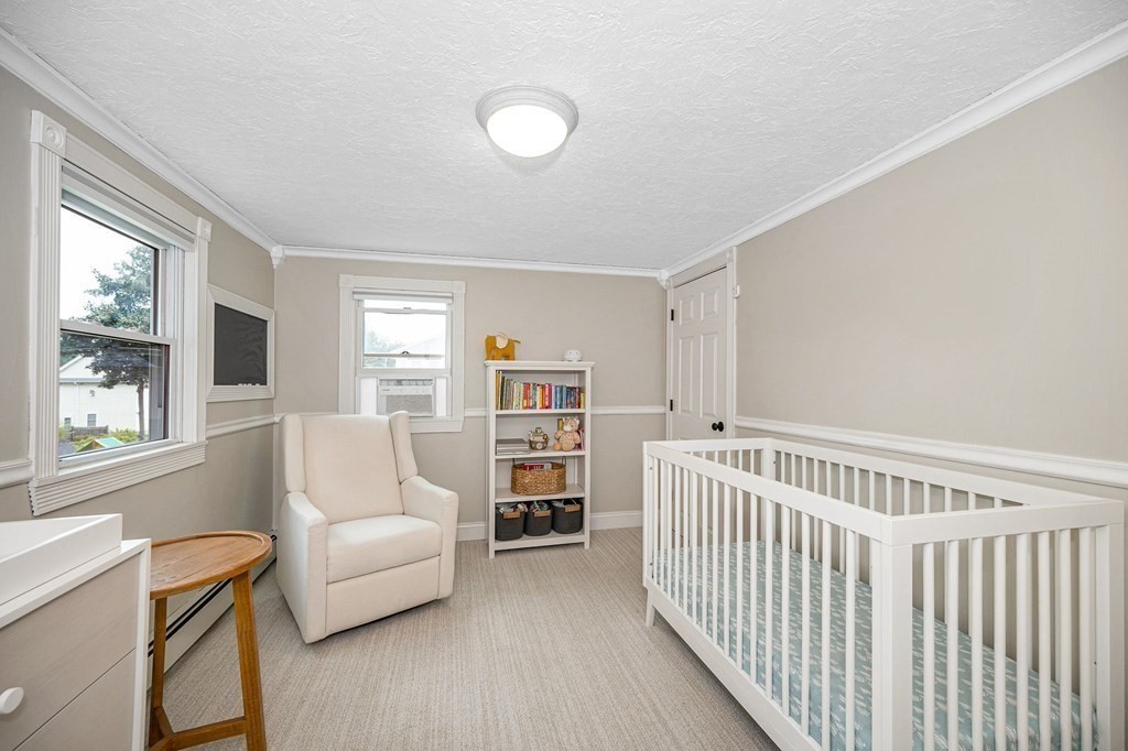 21 Sherwood Road Wilmington, MA 01887 - Photo 20 of 42 a living room with furniture and a large window