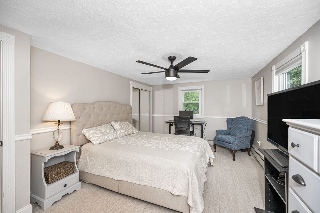 21 Sherwood Road Wilmington, MA 01887 - Photo 26 of 42 a bedroom with bed and a couch