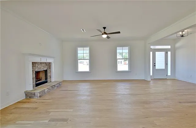 a kitchen with granite countertop white cabinets and stainless steel appliances