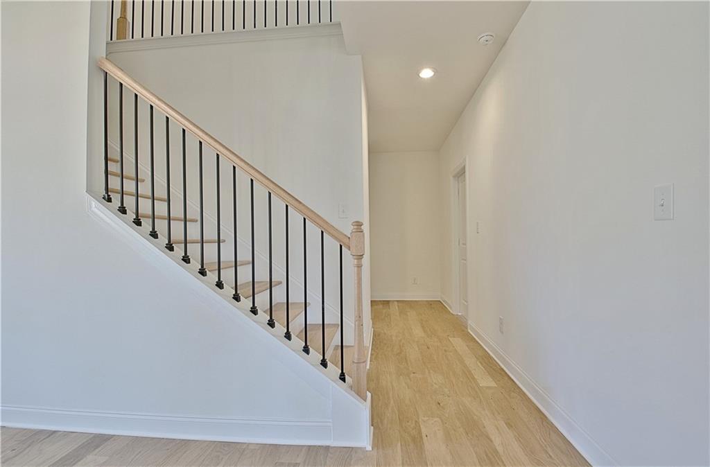 115 Rutland Court Senoia, GA 30276 - Photo 24 of 69 a view of a hallway with wooden floor