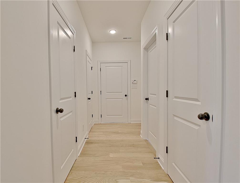 115 Rutland Court Senoia, GA 30276 - Photo 25 of 69 a view of a hallway with white doors