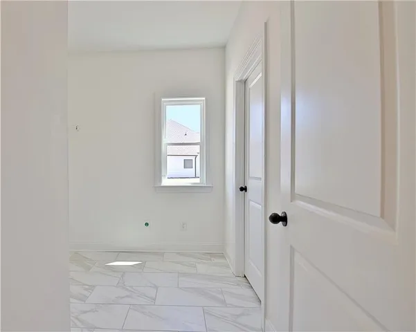 a view of a livingroom from a hallway