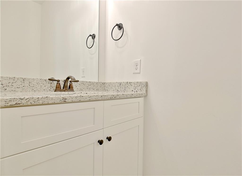 115 Rutland Court Senoia, GA 30276 - Photo 38 of 69 a bathroom with a granite countertop sink and vanity
