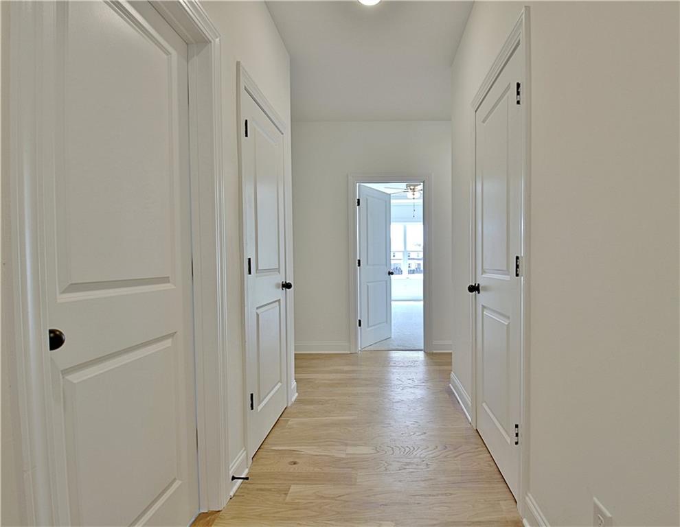 115 Rutland Court Senoia, GA 30276 - Photo 39 of 69 a view of a hallway with wooden floor