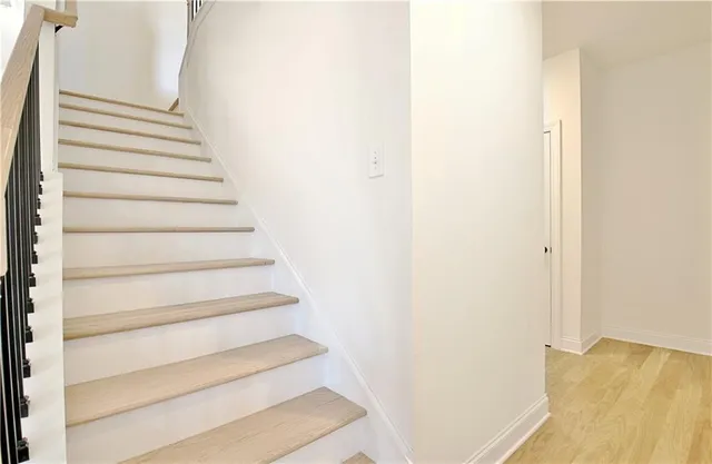 a view of a living room with a floor to ceiling window and a lake view
