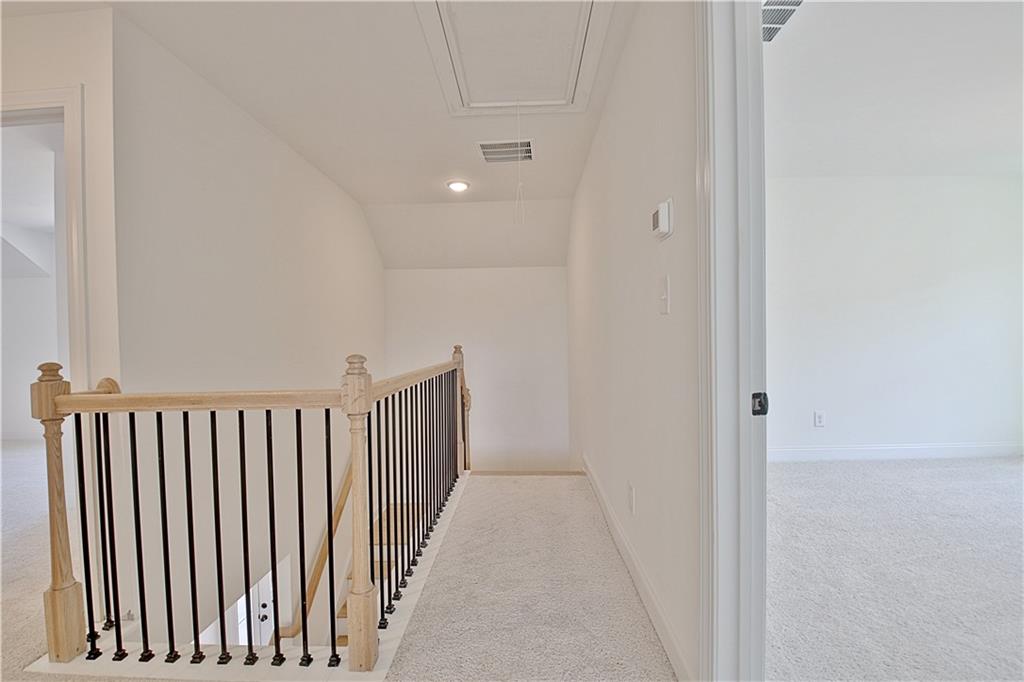 115 Rutland Court Senoia, GA 30276 - Photo 45 of 69 a view of a hallway with wooden floor