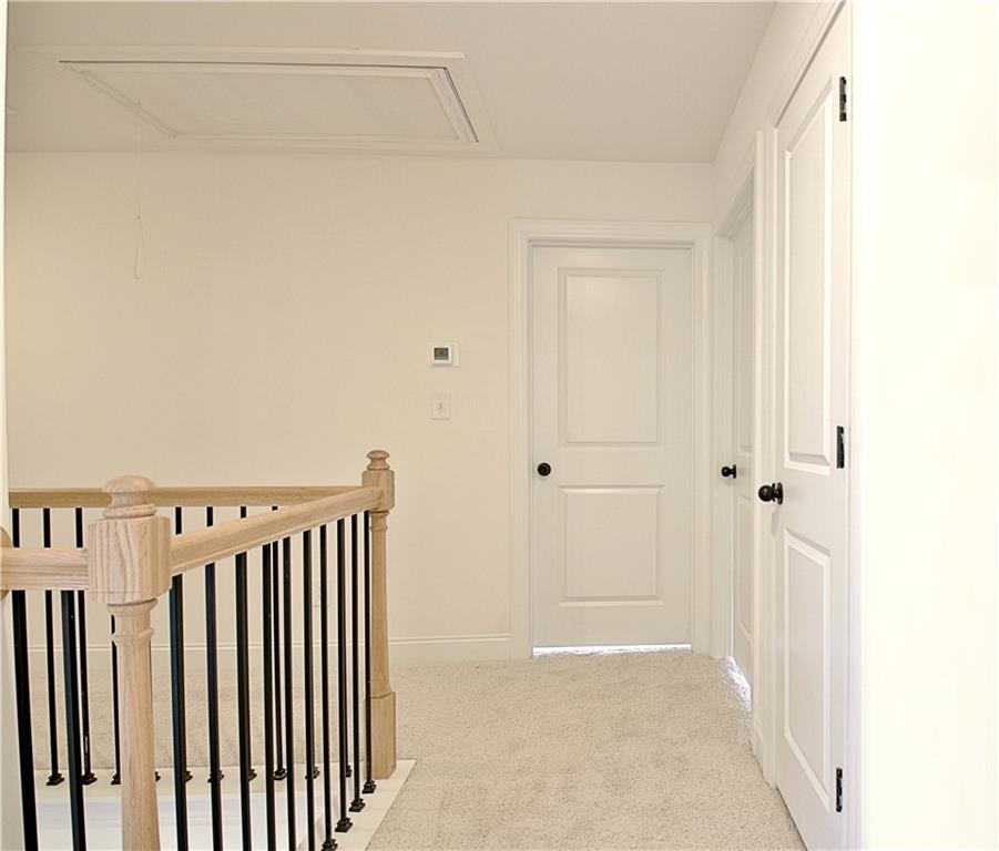 115 Rutland Court Senoia, GA 30276 - Photo 55 of 69 a view of a hallway with wooden floor