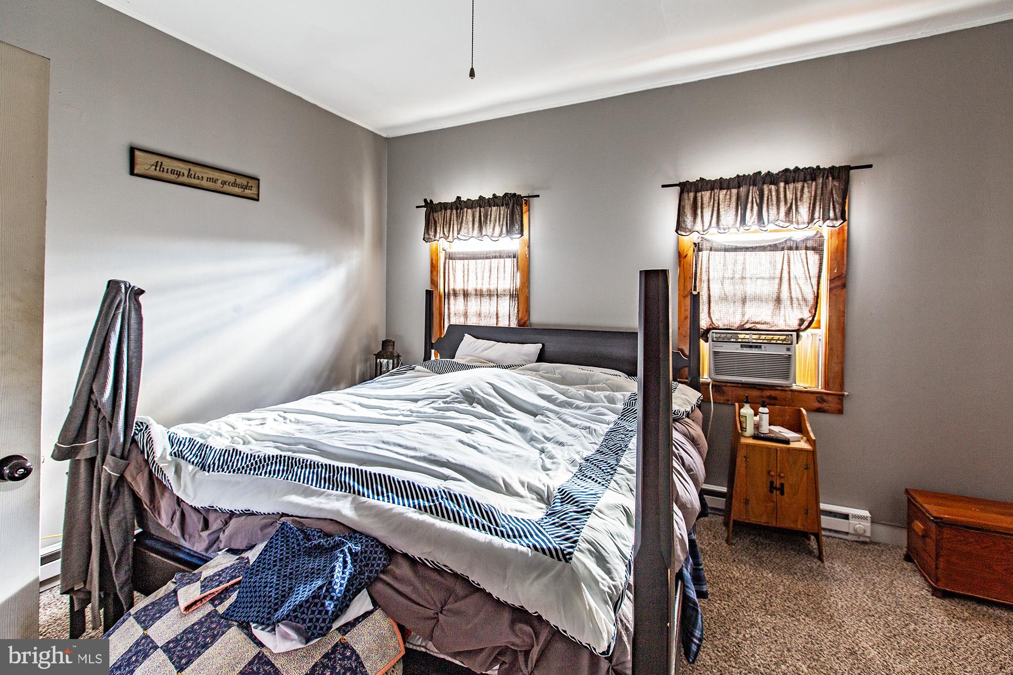 8 Water Street Alloway, NJ 08001 - Photo 11 of 16 a bedroom with a bed and a window