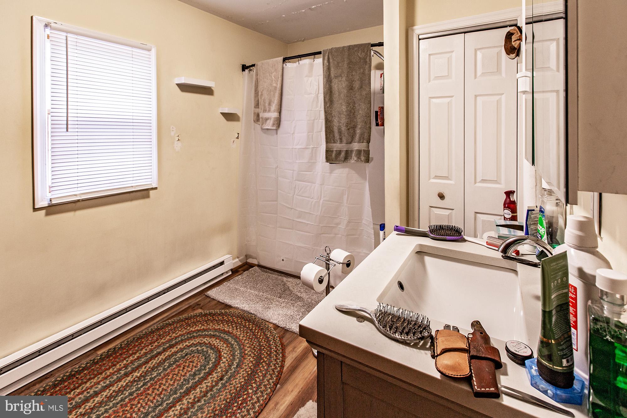 8 Water Street Alloway, NJ 08001 - Photo 16 of 16 a bath room with a bath tub and a shower