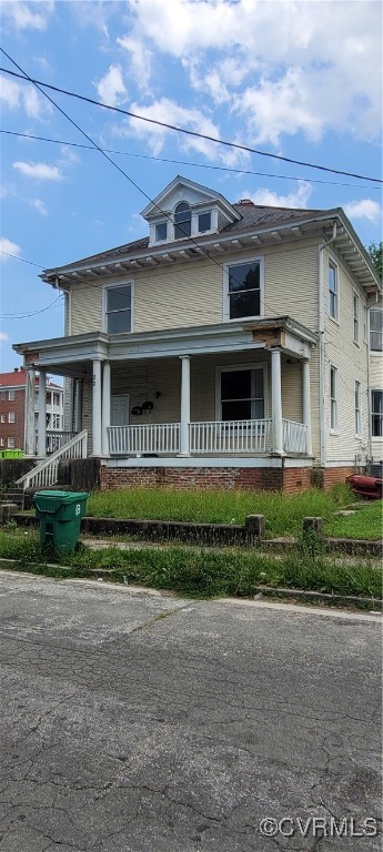 22 Corling Street Petersburg, VA 23803 - Photo 1 of 17 a front view of a house with a garden and plants
