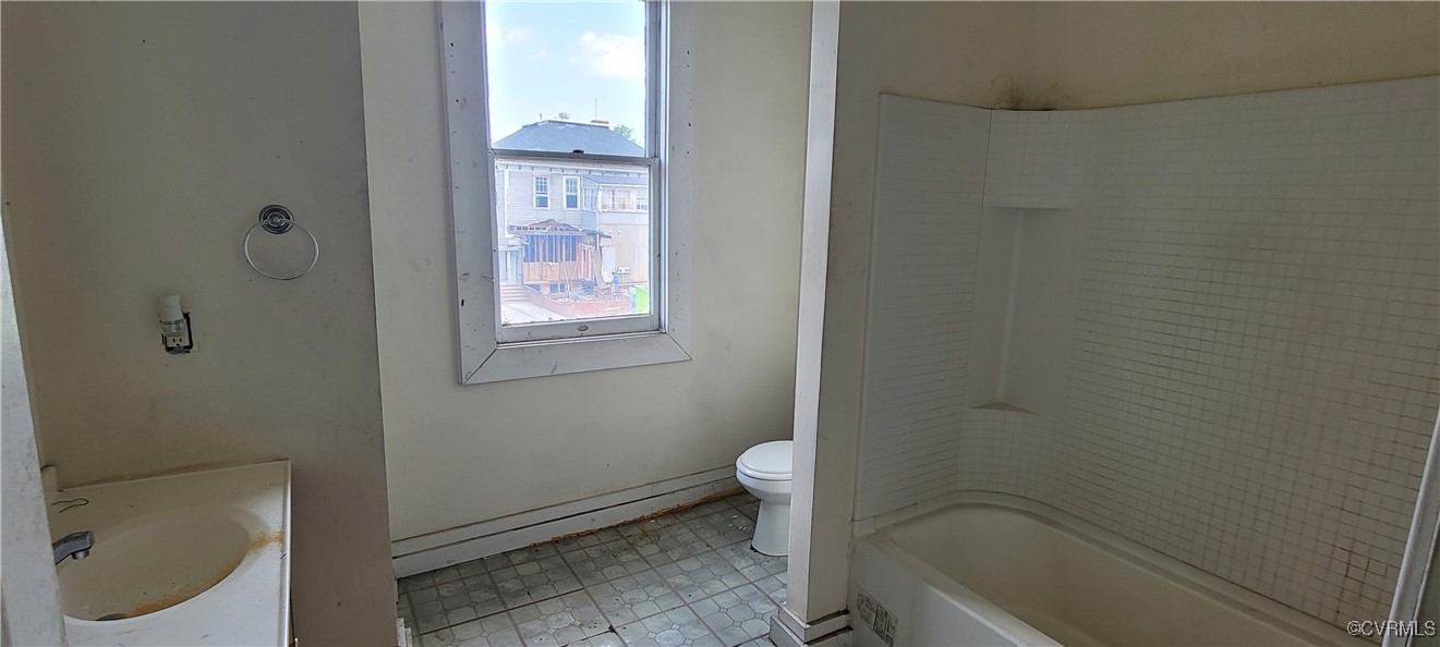 22 Corling Street Petersburg, VA 23803 - Photo 12 of 17 a bathroom with a granite countertop toilet and a sink