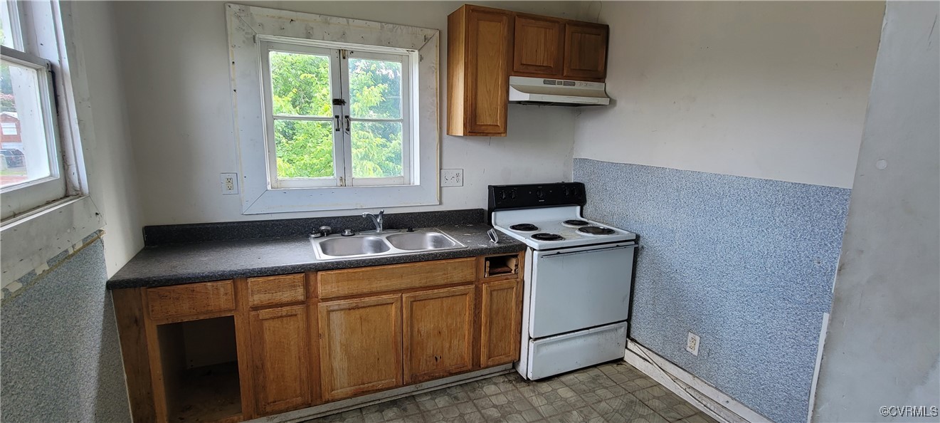 22 Corling Street Petersburg, VA 23803 - Photo 15 of 17 a kitchen with a sink cabinets and a window