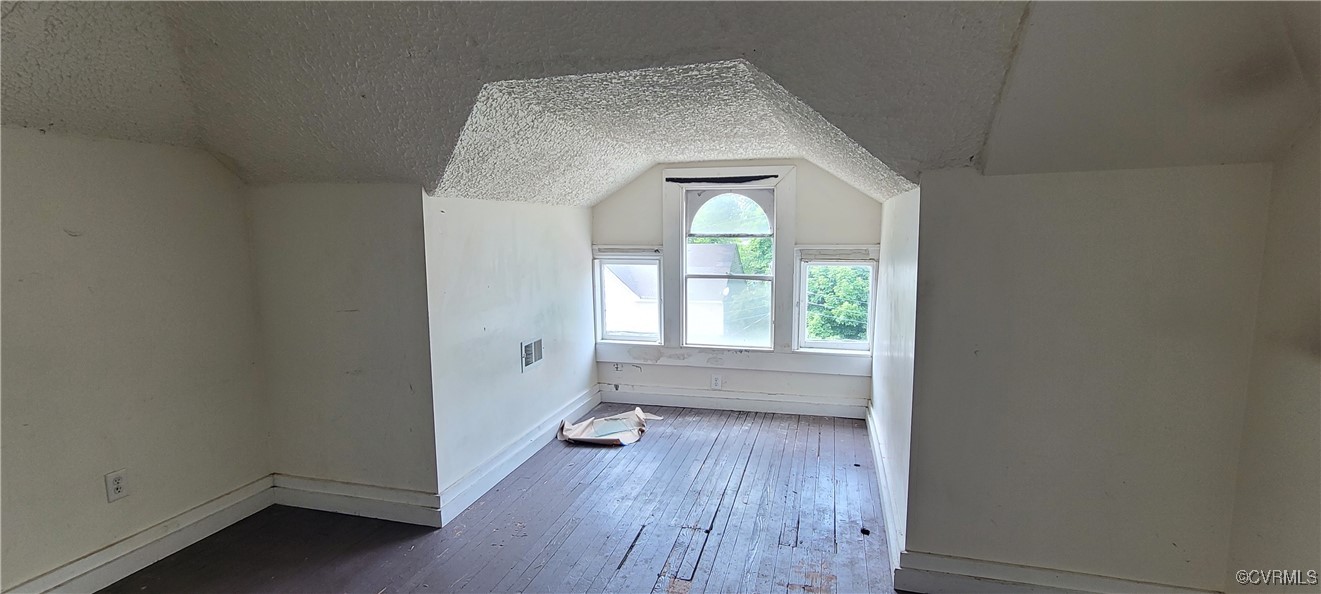 22 Corling Street Petersburg, VA 23803 - Photo 16 of 17 an empty room with wooden floor and windows