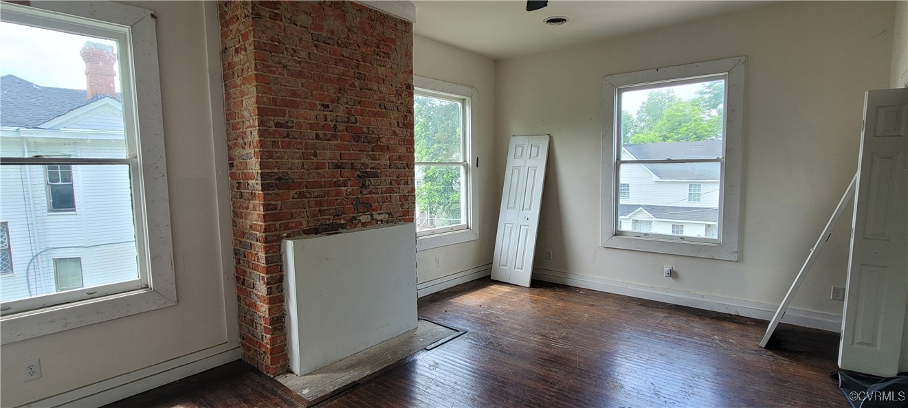 22 Corling Street Petersburg, VA 23803 - Photo 10 of 17 a view of an empty room with wooden floor and a window