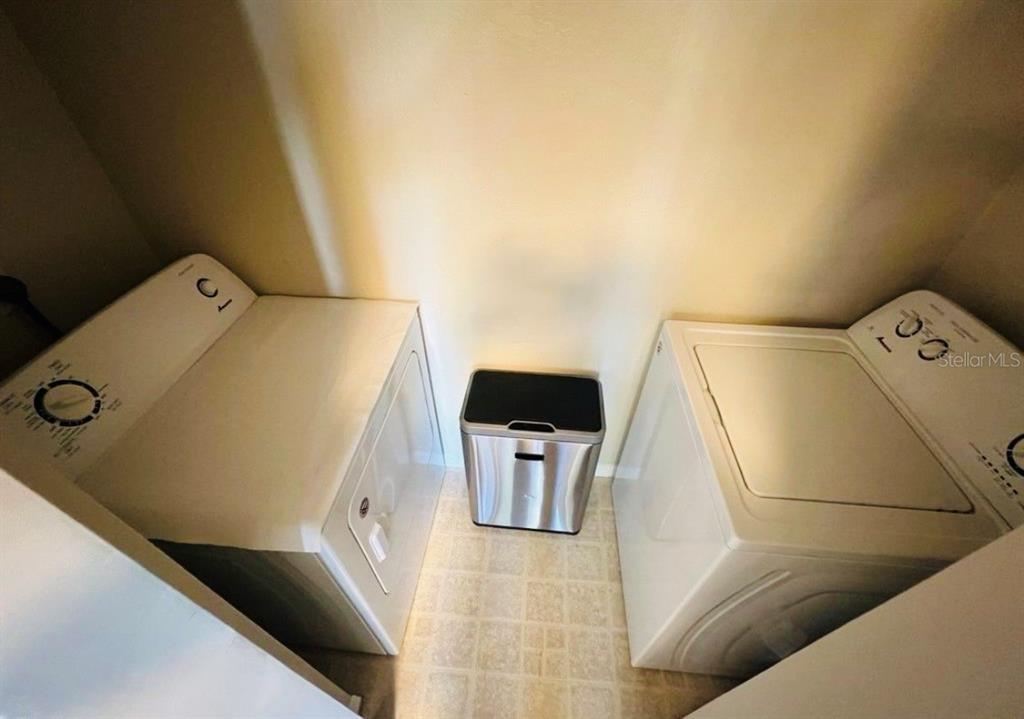 1081 South Hiawassee Road, Unit 721 Orlando, FL 32835 - Photo 13 of 18 a utility room with dryer and washer