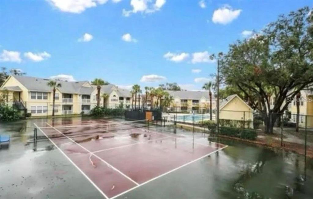 1081 South Hiawassee Road, Unit 721 Orlando, FL 32835 - Photo 15 of 18 a view of a house with yard and lake view