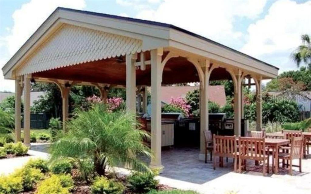 1081 South Hiawassee Road, Unit 721 Orlando, FL 32835 - Photo 16 of 18 a view of a two chairs and table in the patio