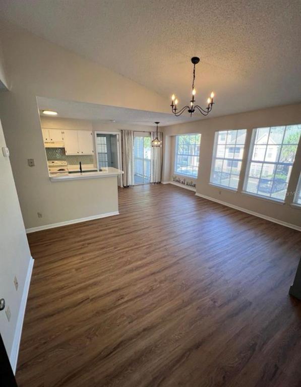 1081 South Hiawassee Road, Unit 721 Orlando, FL 32835 - Photo 2 of 18 an empty room with wooden floor and windows