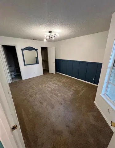 an empty room with a empty space and a window