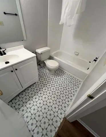 a bathroom with a sink toilet and bathtub