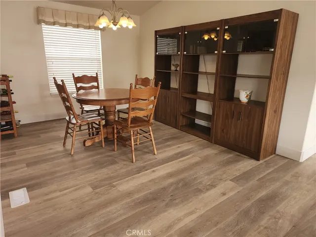 a dining room with furniture and window