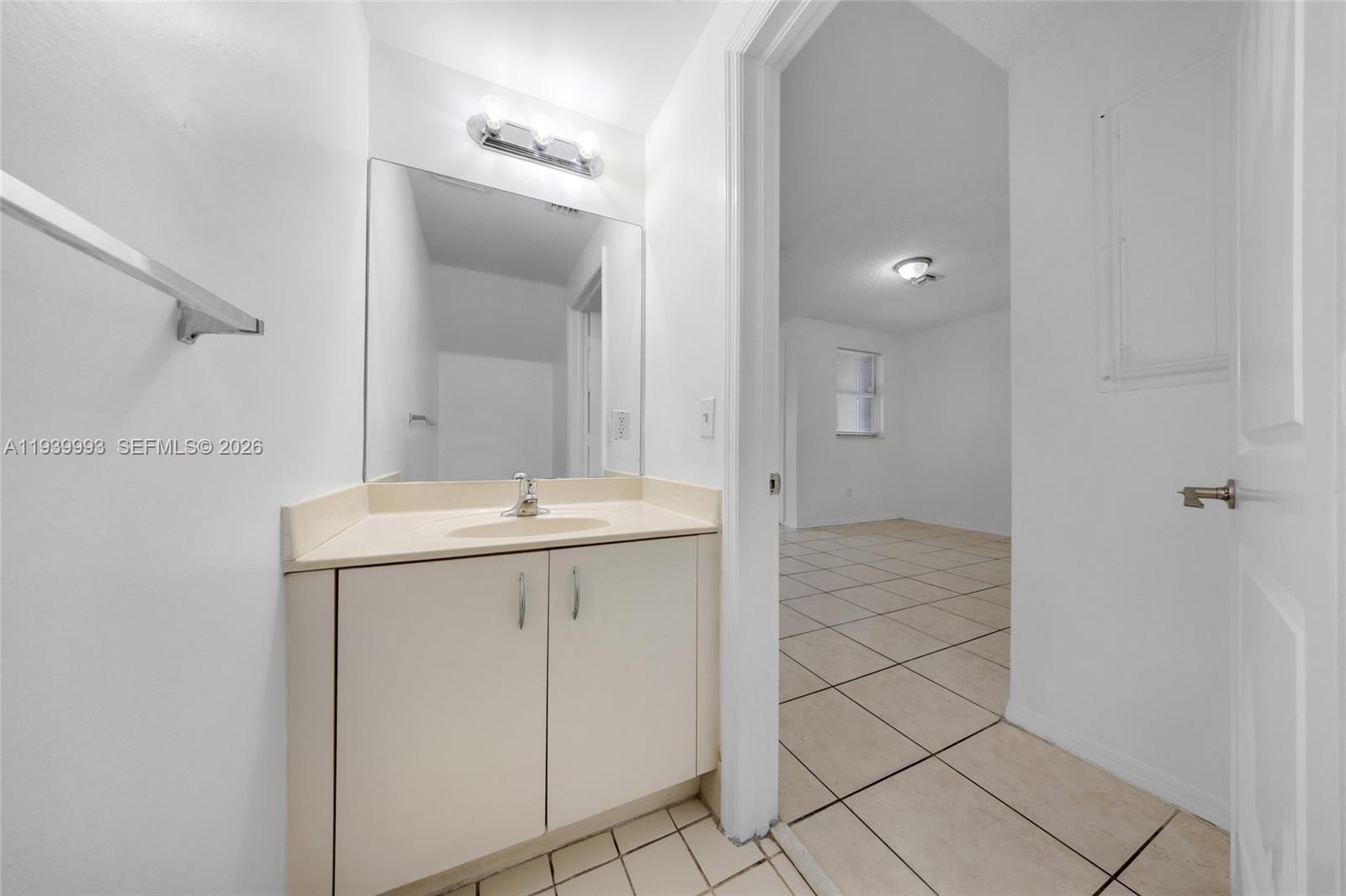 951 Northeast 42nd Terrace, Unit 951 Homestead, FL 33033 - Photo 11 of 30 a bathroom with a sink a toilet and shower