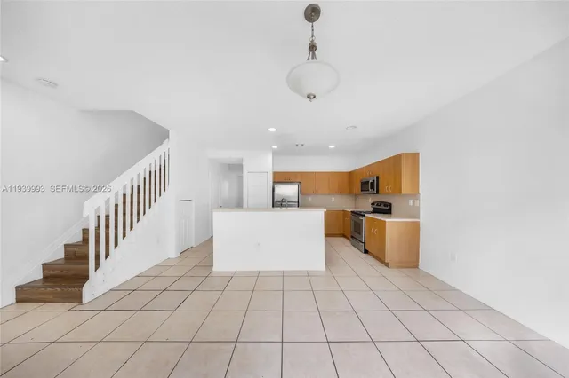 a view of a living room and entryway