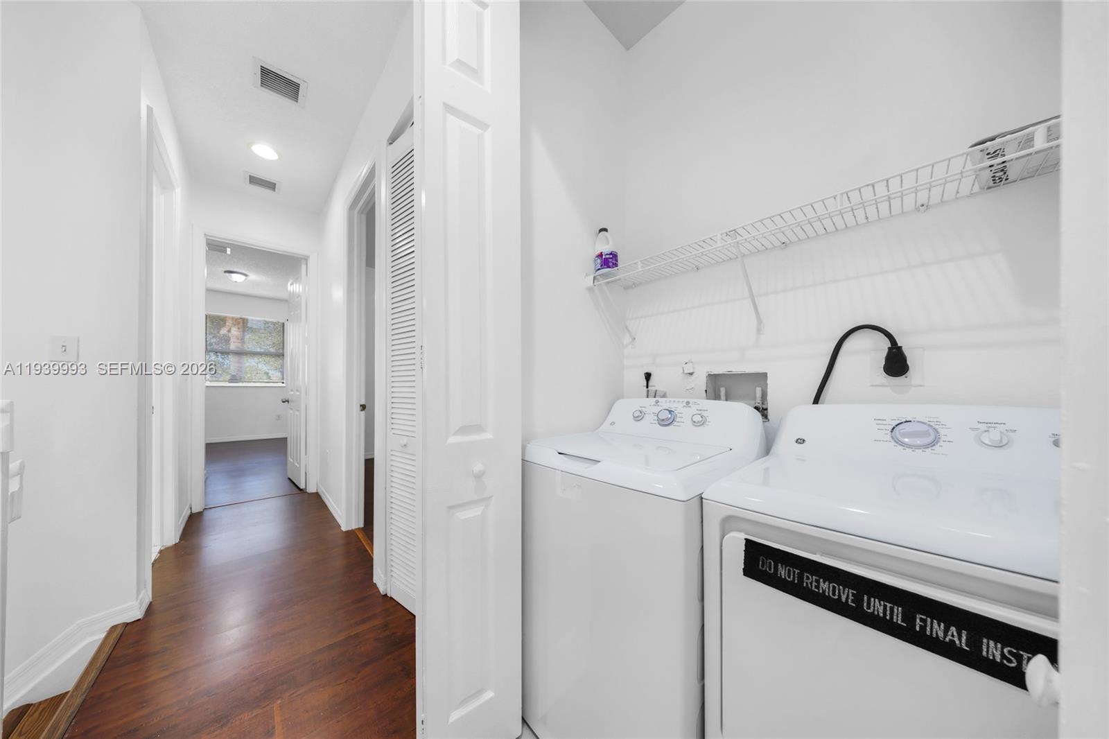 951 Northeast 42nd Terrace, Unit 951 Homestead, FL 33033 - Photo 20 of 30 a view of a bathroom with a sink dryer and washer