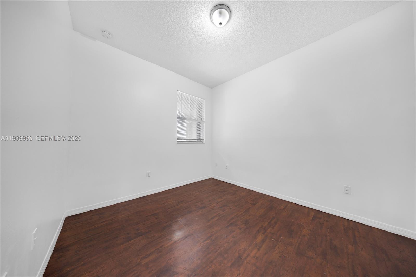 951 Northeast 42nd Terrace, Unit 951 Homestead, FL 33033 - Photo 22 of 30 an empty room with a workbench