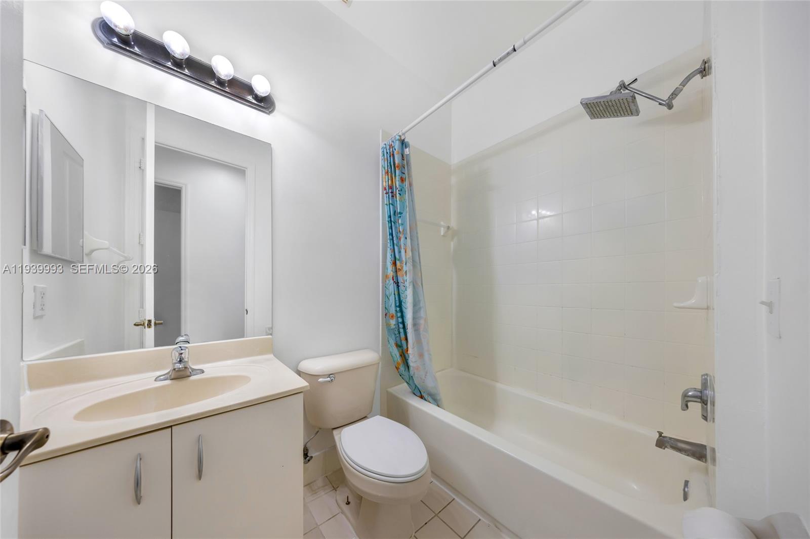 951 Northeast 42nd Terrace, Unit 951 Homestead, FL 33033 - Photo 25 of 30 a bathroom with a granite countertop sink toilet and shower