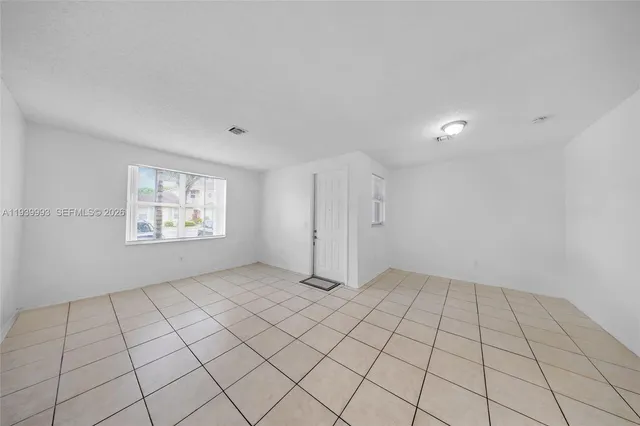 a view of an empty room and window