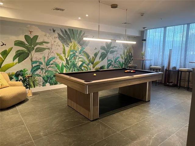 a room with furniture and a potted plant