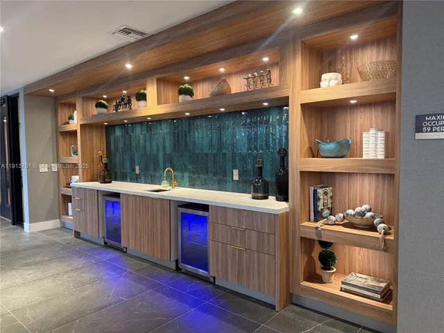 a open kitchen with a sink and dishwasher with a kitchen island