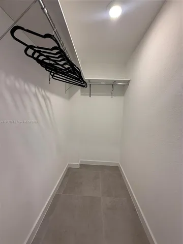 a view of a room with racks on the wall