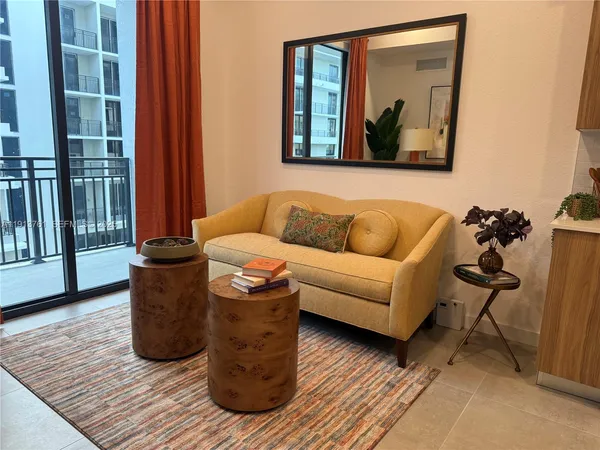 a living room with furniture and a window