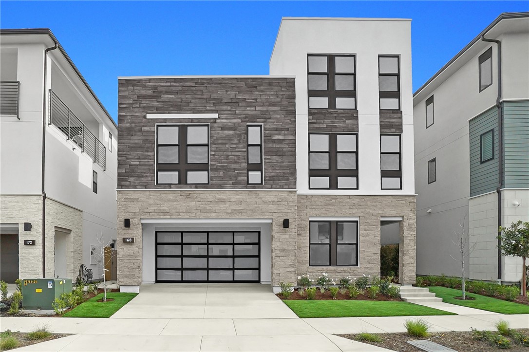 168 Creation Irvine, CA 92618 - Photo 1 of 59 a front view of a building with a garden