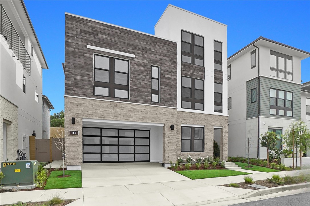 168 Creation Irvine, CA 92618 - Photo 2 of 59 a front view of a building with a garden