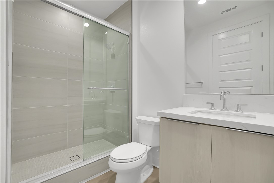 168 Creation Irvine, CA 92618 - Photo 21 of 59 a bathroom with a sink toilet and shower