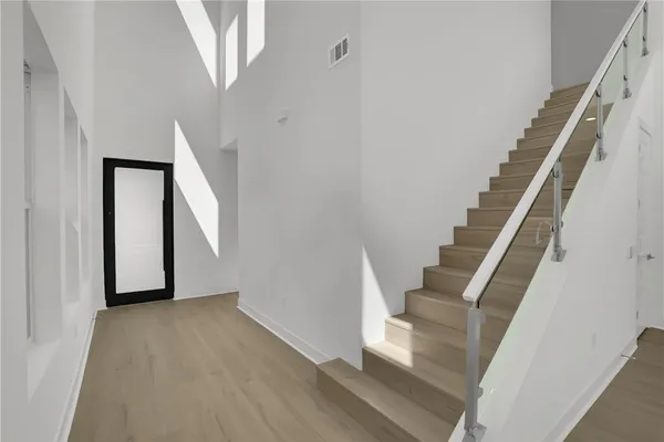a view of entryway with wooden floor