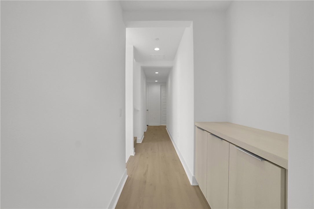 168 Creation Irvine, CA 92618 - Photo 23 of 59 a view of a hallway with wooden floor
