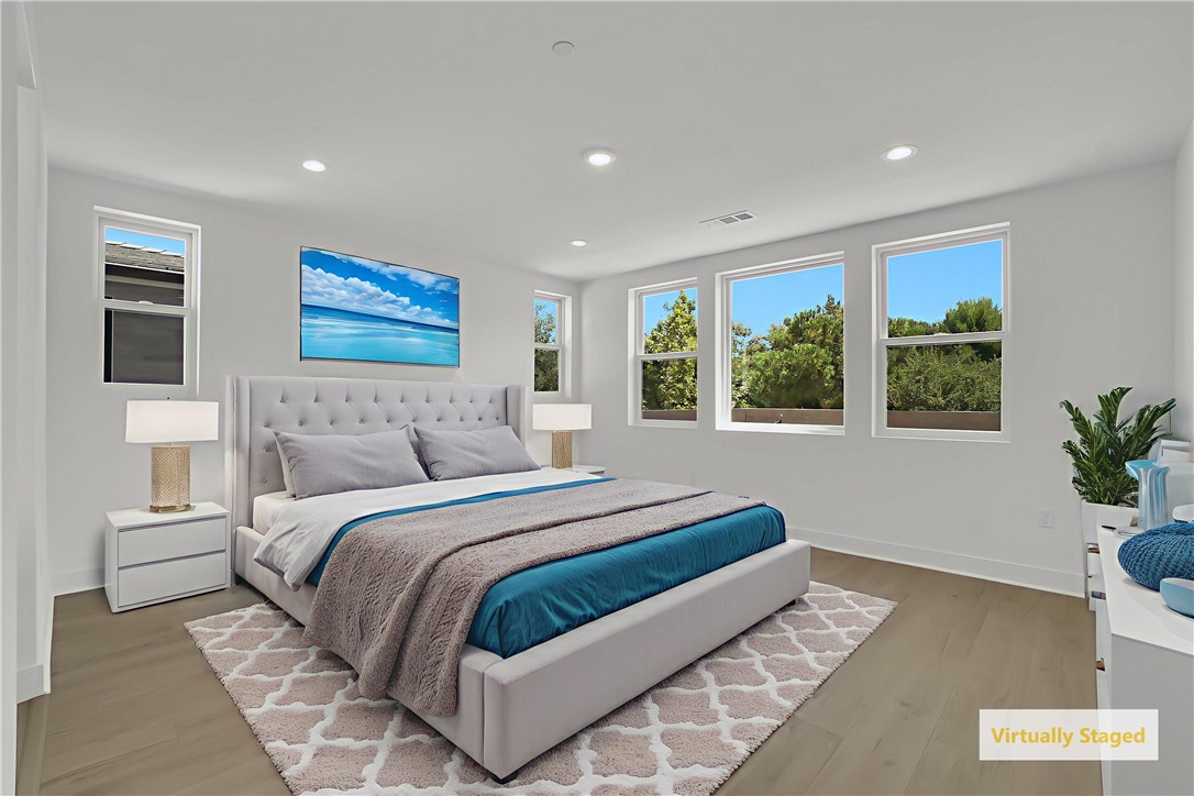 168 Creation Irvine, CA 92618 - Photo 25 of 59 a bedroom with a large bed and a large window