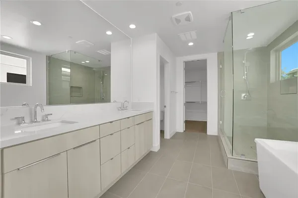 a bathroom with a bathtub and a sink