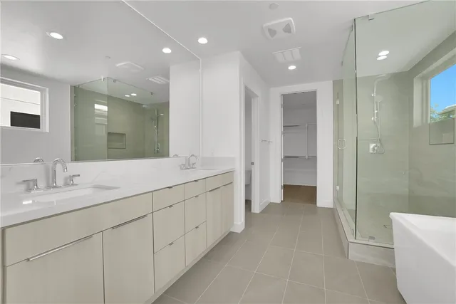 a bathroom with a bathtub and a sink