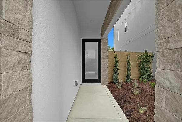 a view of a front door and wooden floor
