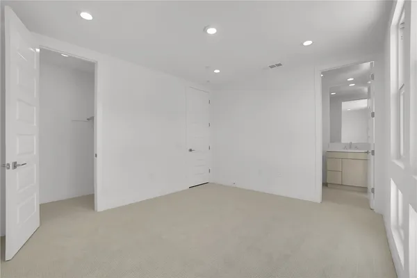 a bedroom with a bed and a couch