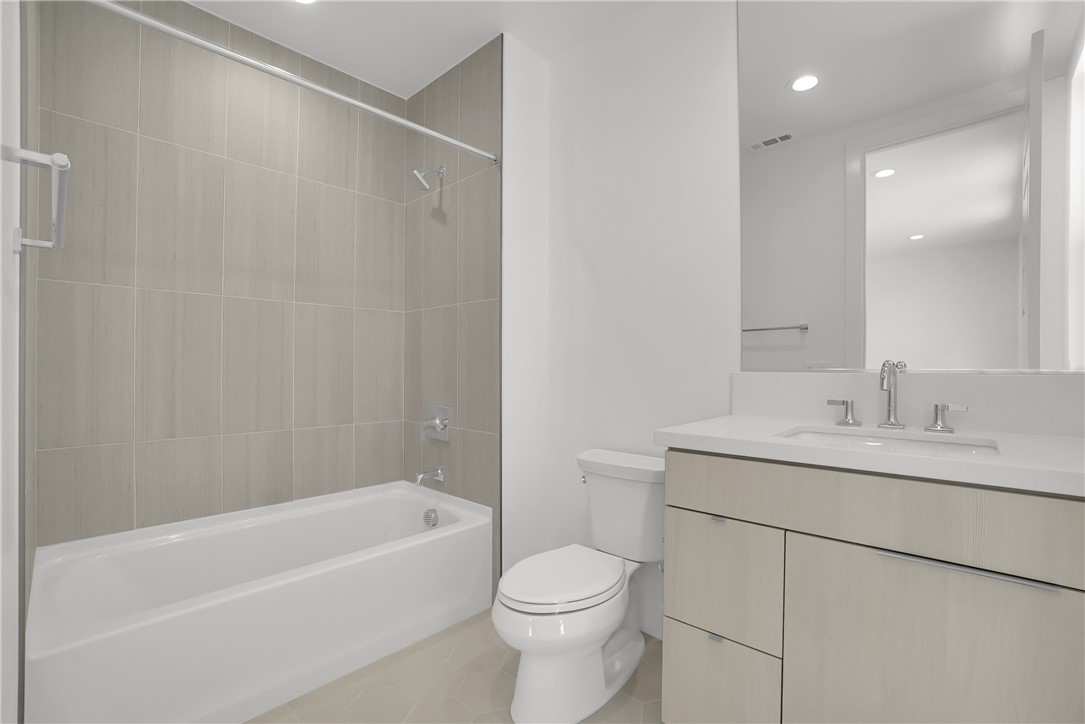 168 Creation Irvine, CA 92618 - Photo 35 of 59 a bathroom with a sink a toilet and shower