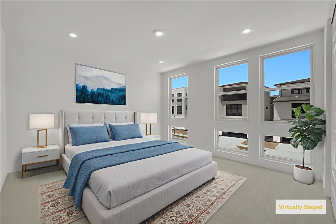 168 Creation Irvine, CA 92618 - Photo 37 of 59 a bedroom with a large bed and a potted plant