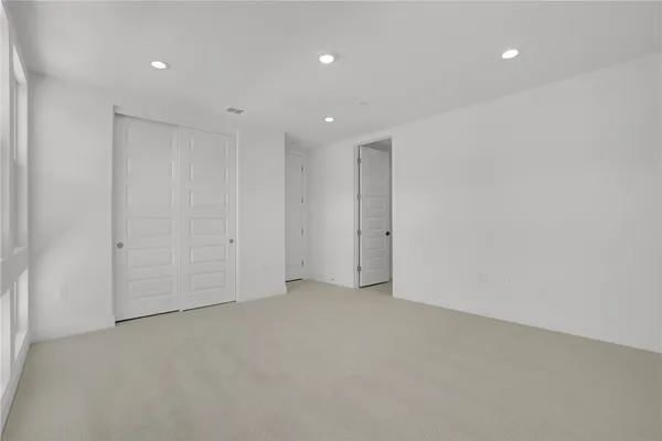 a living room with furniture a flat screen tv and a large window