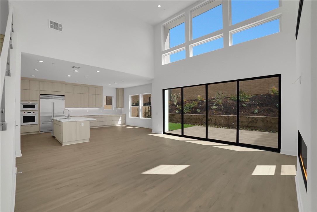 168 Creation Irvine, CA 92618 - Photo 4 of 59 a view of a kitchen with large windows